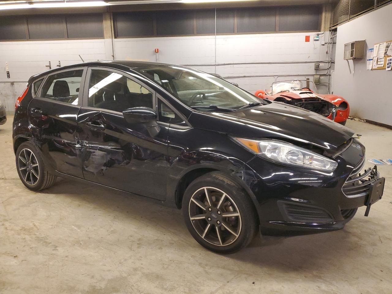 2018 Ford Fiesta VIN 3FADP4EJ4JM133984 Copart auction photo, front end / side damage thumbnail 4
