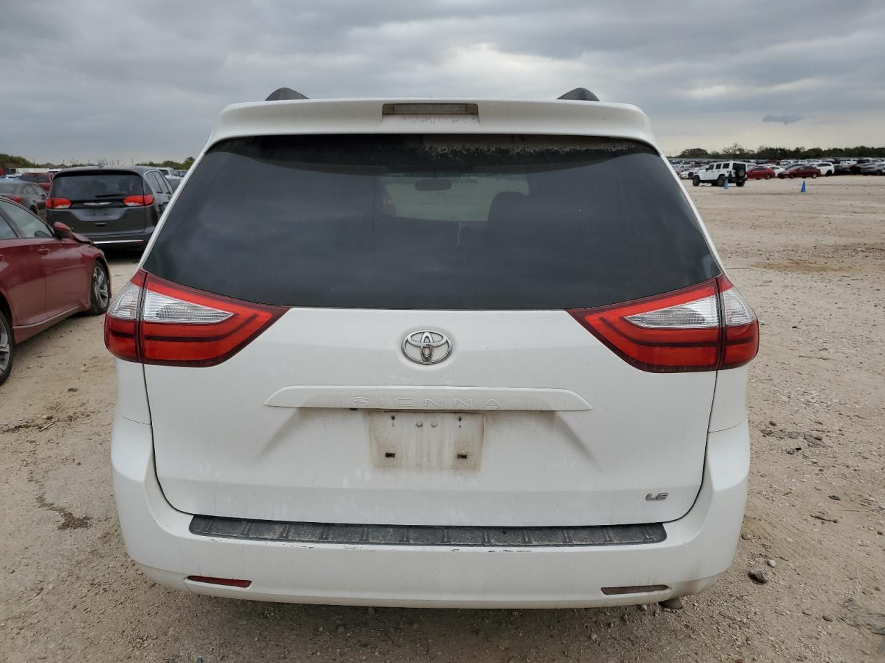 2015 Toyota Sienna VIN 5TDKK3DC0FS669769 Copart auction photo, side / front end damage thumbnail 6