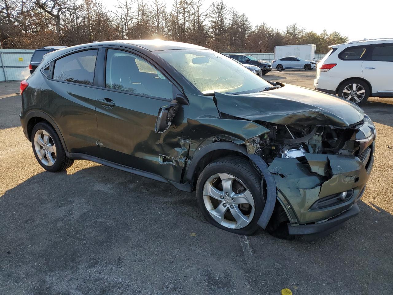 2016 Honda HR-V VIN 3CZRU6H51GM742374 Copart auction photo, front end / side damage thumbnail 4