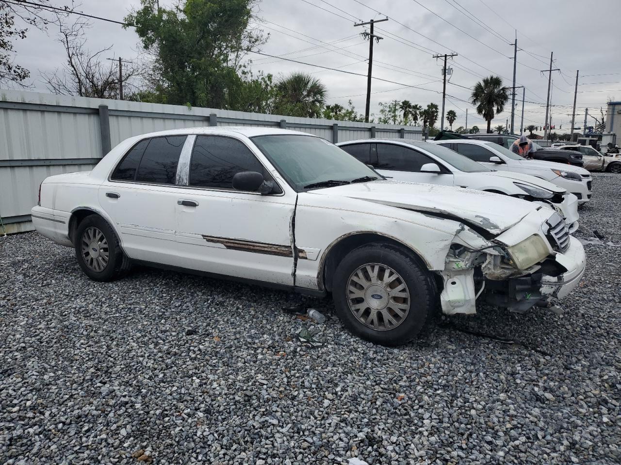 2004 Ford Crown Victoria VIN 2FAFP74W54X182465 Copart auction photo, front end / side damage thumbnail 4