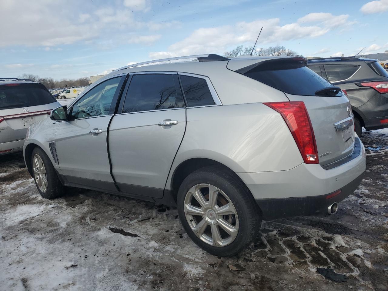 2015 Cadillac SRX VIN 3GYFNGE39FS585762 Copart auction photo, side / front end damage thumbnail 2