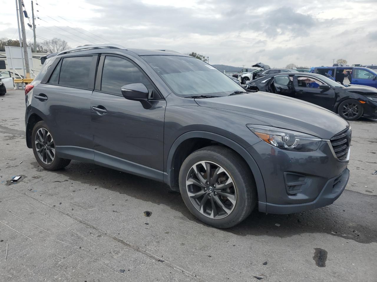 2016 Mazda CX-5 VIN JM3KE4DY5G0607837 Copart auction photo, minor dent/scratches damage thumbnail 4