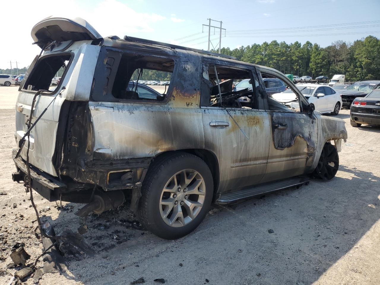 2015 Chevrolet Tahoe VIN 1GNSCCKC9FR239681 Copart auction photo, burn damage thumbnail 3