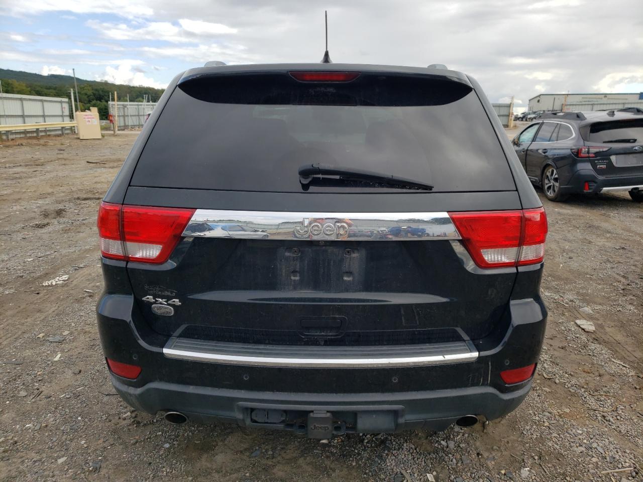 2012 Jeep Grand Cherokee VIN 1C4RJFCT0CC228645 Copart auction photo, front end / undercarriage damage thumbnail 6