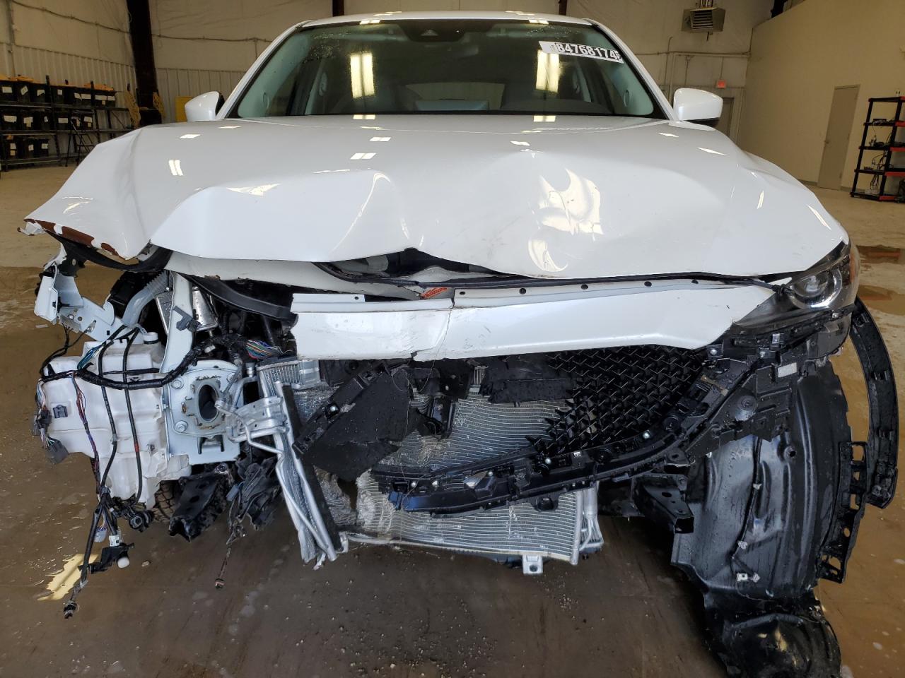 2021 Mazda CX-5 VIN JM3KFBCM0M0498876 Copart auction photo, front end / undercarriage damage thumbnail 5