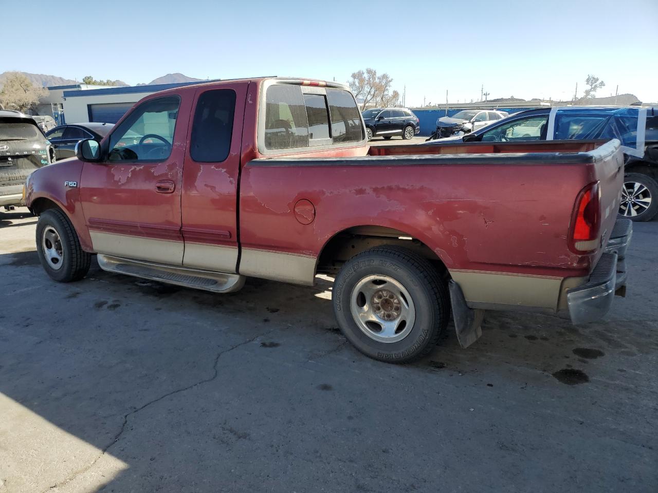 1999 Ford F-150 VIN 1FTRX17L1XKB23992 Copart auction photo, front end / rear end damage thumbnail 2