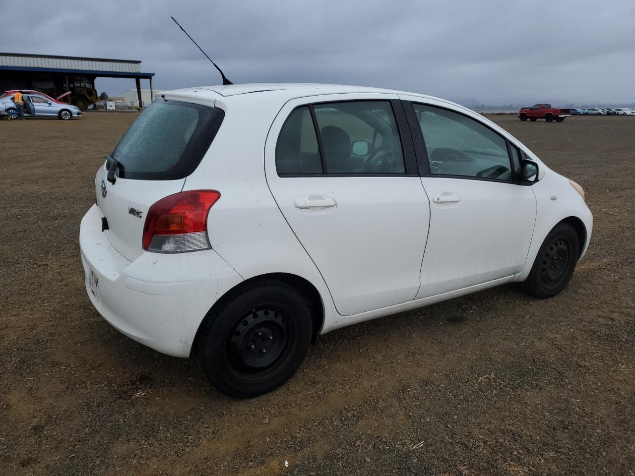 2009 Toyota Yaris VIN JTDKT903795261219 Copart auction photo, side damage thumbnail 3