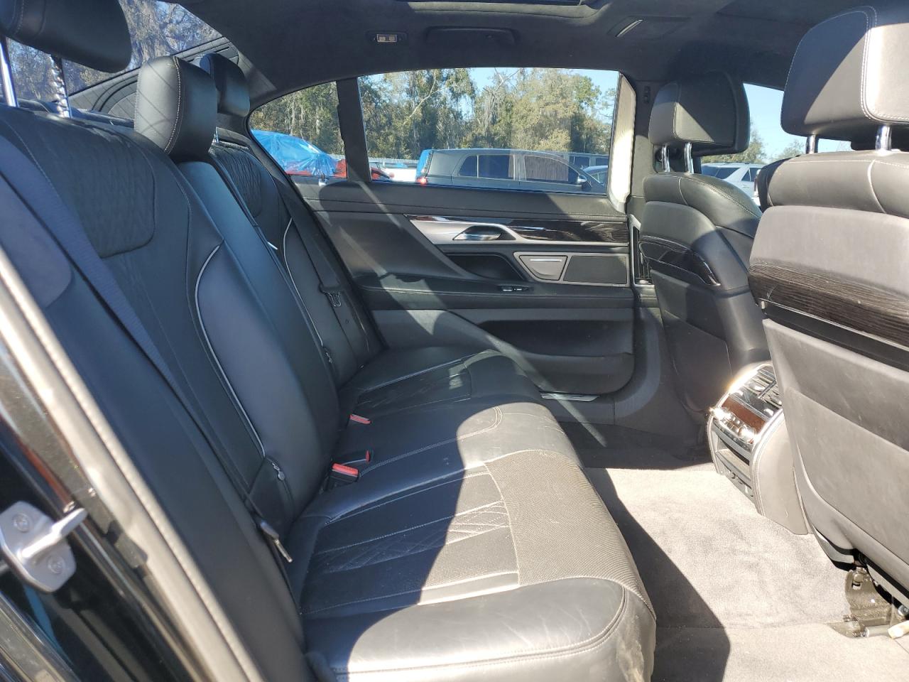 2016 BMW 7er VIN WBA7F0C5XGGL99549 Copart auction photo, rear end / side damage thumbnail 10