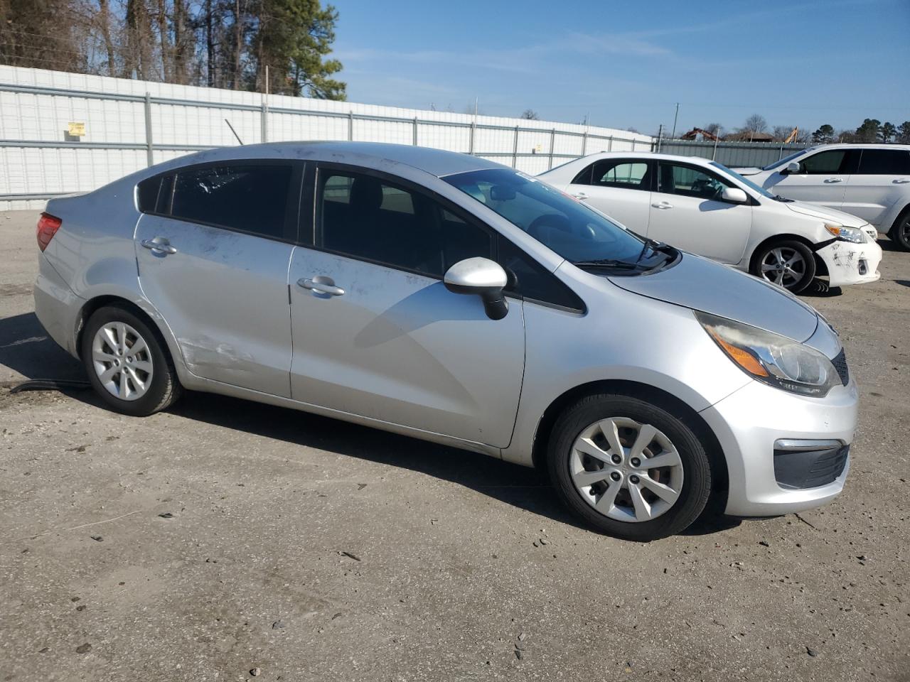 2016 KIA Rio VIN KNADM4A34G6597647 Copart auction photo, side / vandalism damage thumbnail 4