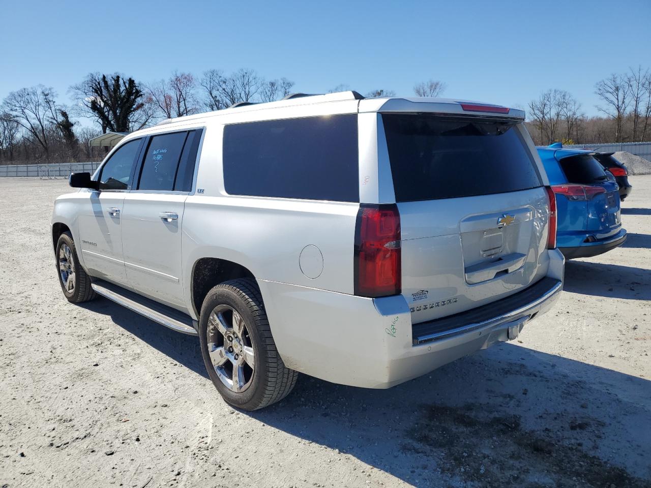 2015 Chevrolet Suburban VIN 1GNSKKKC6FR549249 Copart auction photo, front end / rear end damage thumbnail 2