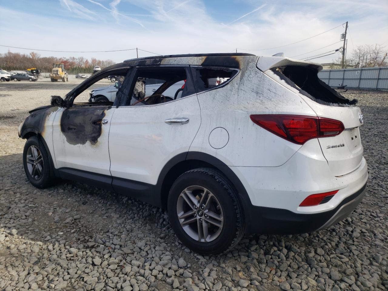 2017 Hyundai Santa Fe VIN 5NMZUDLBXHH020963 Copart auction photo, burn damage thumbnail 2