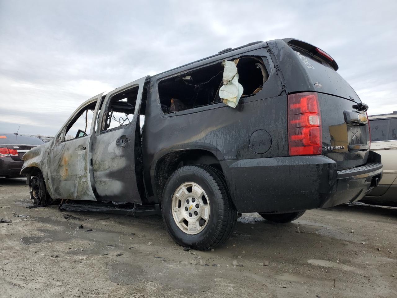 2012 Chevrolet Suburban VIN 1GNSKJE79CR315756 Copart auction photo, burn damage thumbnail 2