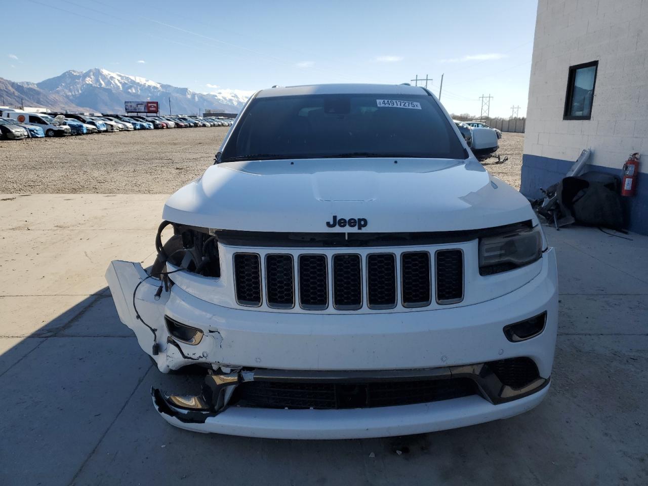 2015 Jeep Grand Cherokee VIN 1C4RJFCG8FC165785 Copart auction photo, front end / side damage thumbnail 5