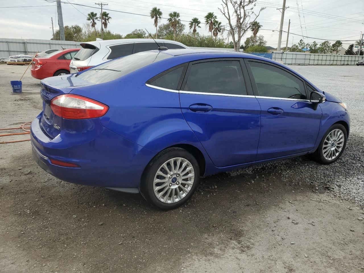 2014 Ford Fiesta VIN 3FADP4CJ2EM205399 Copart auction photo, side / front end damage thumbnail 3