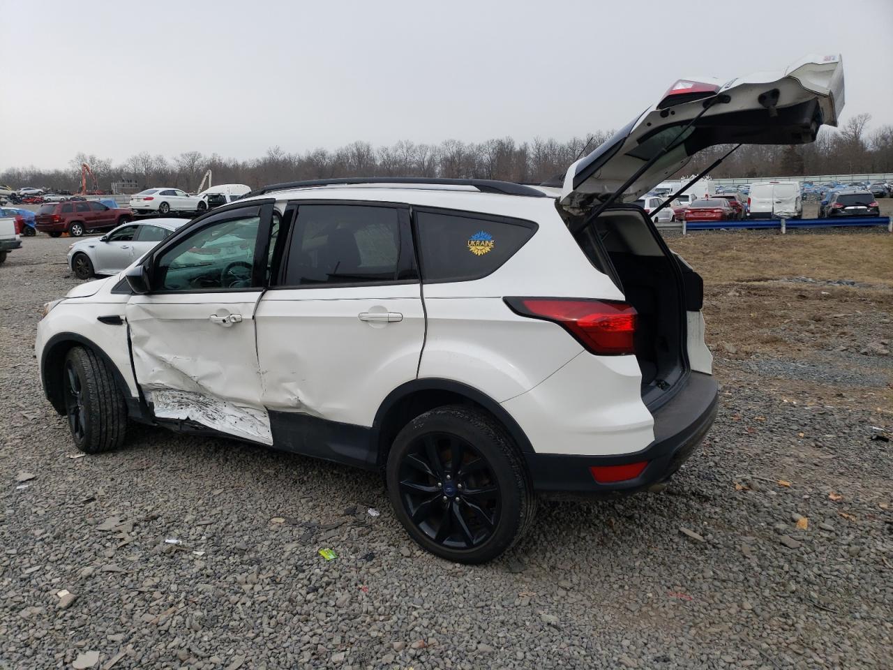 2019 Ford Escape VIN 1FMCU9GD7KUC18944 Copart auction photo, rollover damage thumbnail 2