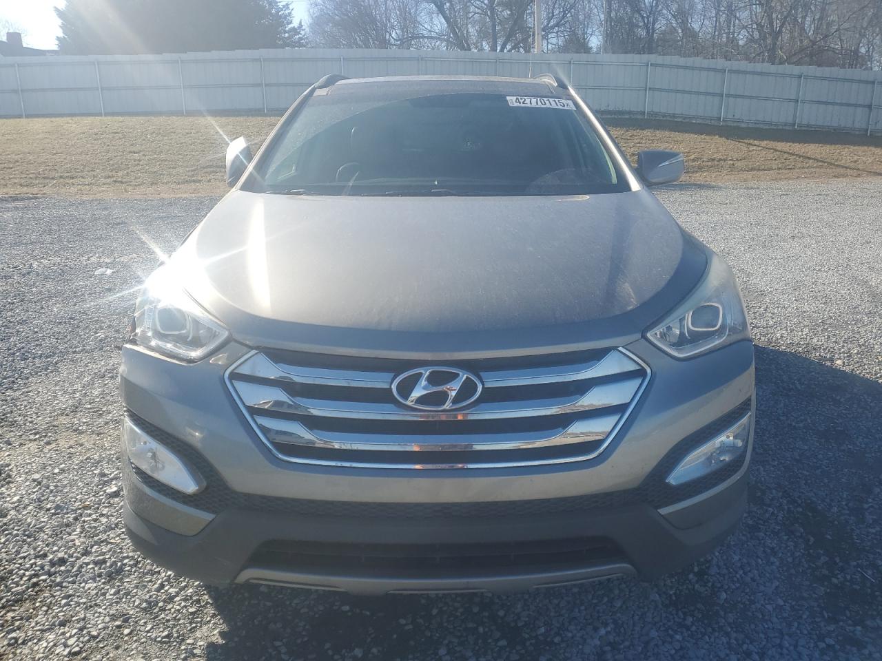2014 Hyundai Santa Fe VIN 5XYZU3LBXEG140357 Copart auction photo, front end / rear end damage thumbnail 5