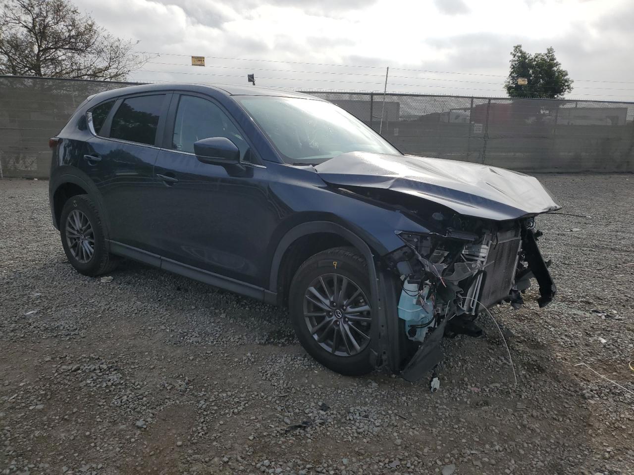 2021 Mazda CX-5 VIN JM3KFACM1M0313910 Copart auction photo, front end damage thumbnail 4