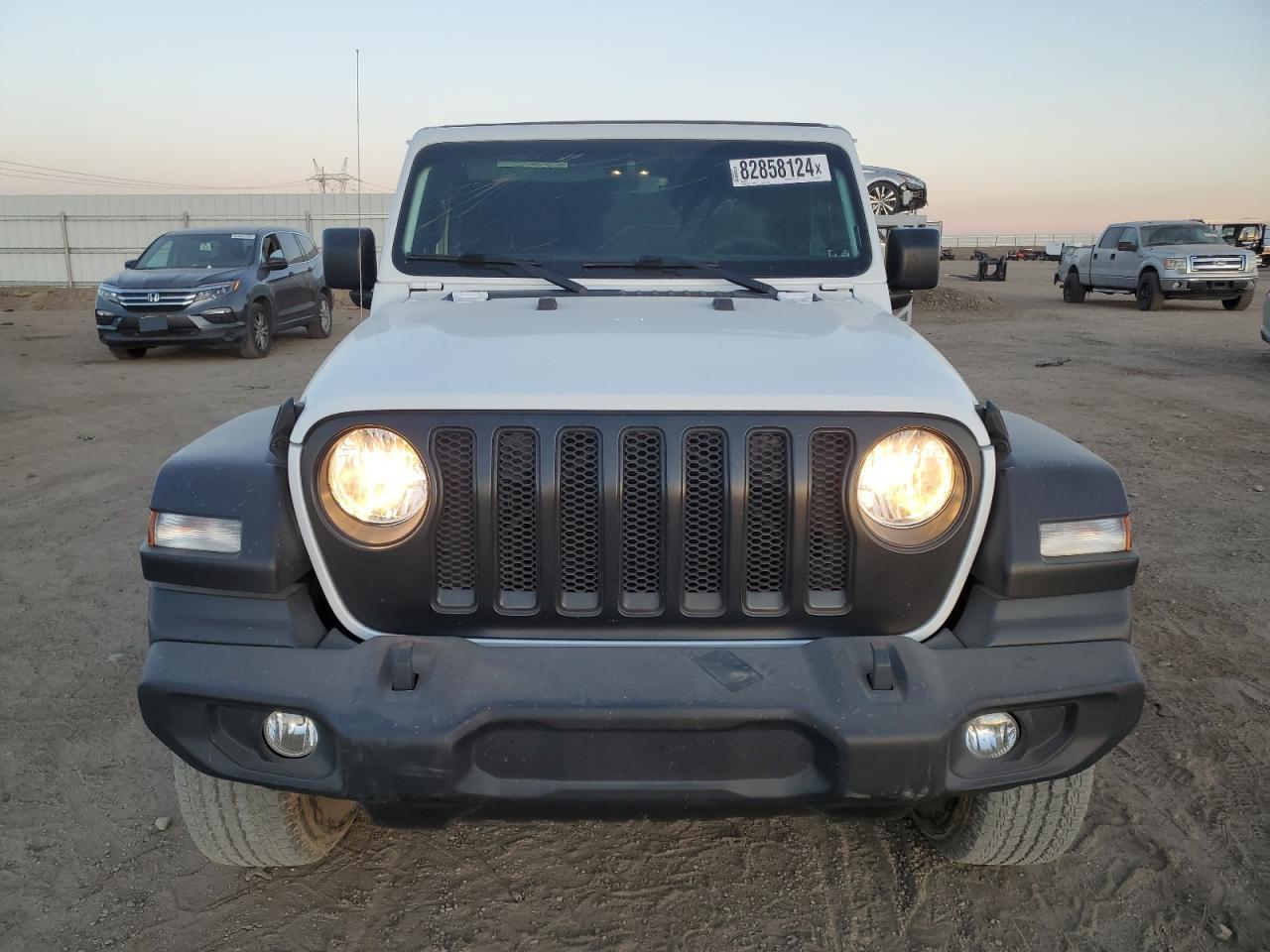 2021 Jeep Wrangler VIN 1C4HJXDM9MW663219 Copart auction photo, all over damage thumbnail 5