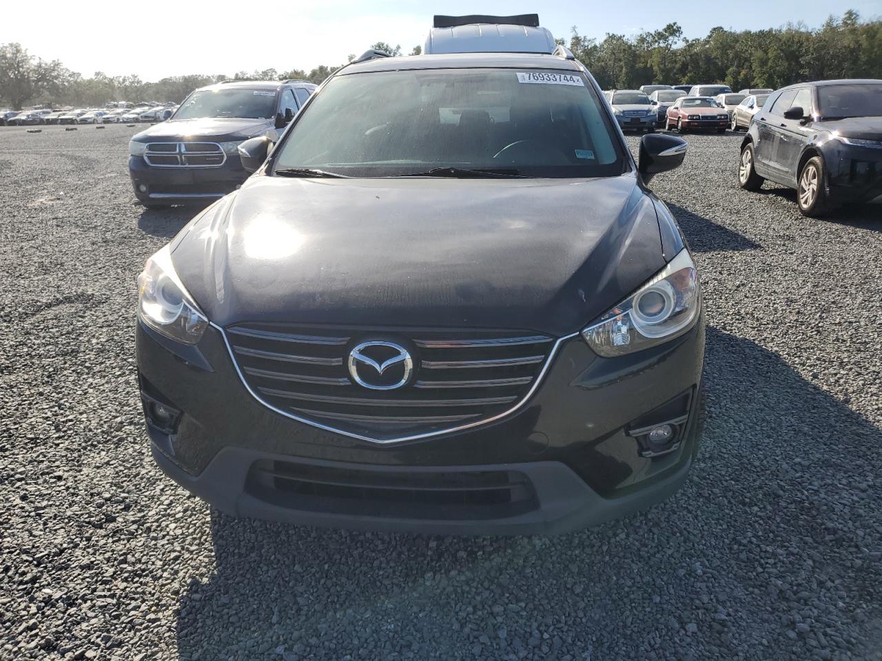 2016 Mazda CX-5 VIN JM3KE2DY5G0696281 Copart auction photo, water/flood damage thumbnail 5