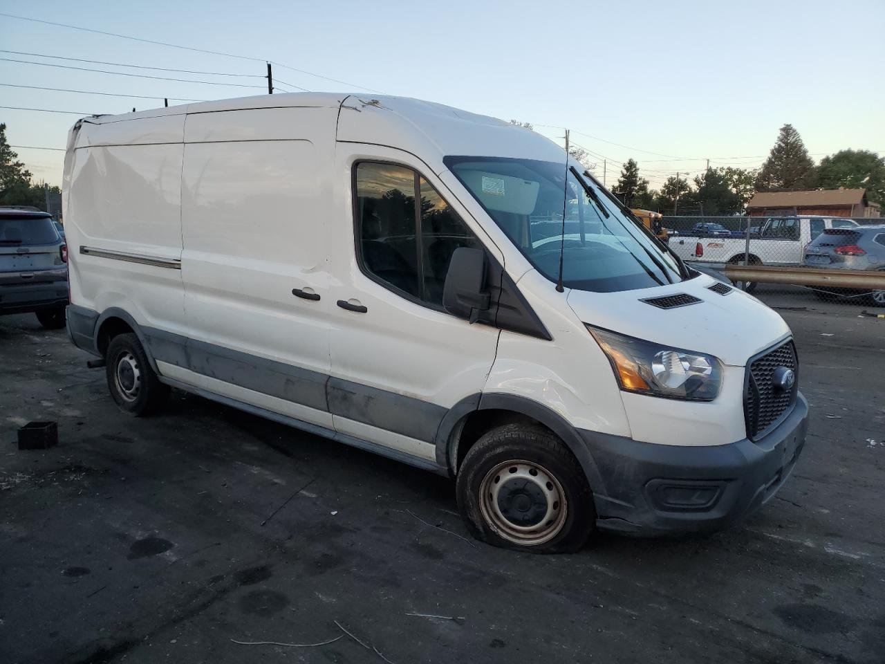 2021 Ford Transit VIN 1FTBR1C88MKA31593 Copart auction photo, all over damage thumbnail 4