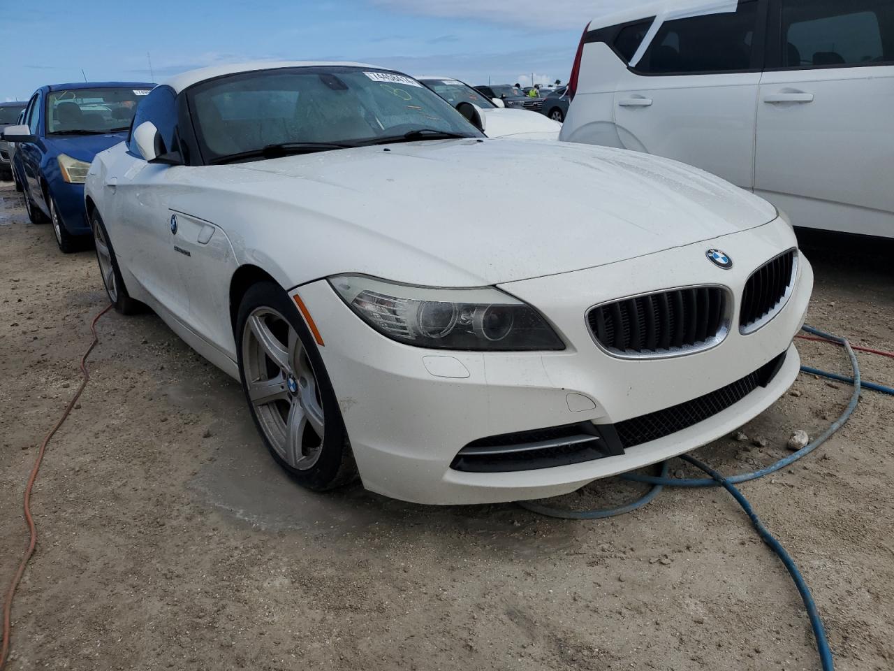 2011 BMW Z4 VIN WBALM5C54BE379870 Copart auction photo, water/flood damage thumbnail 4