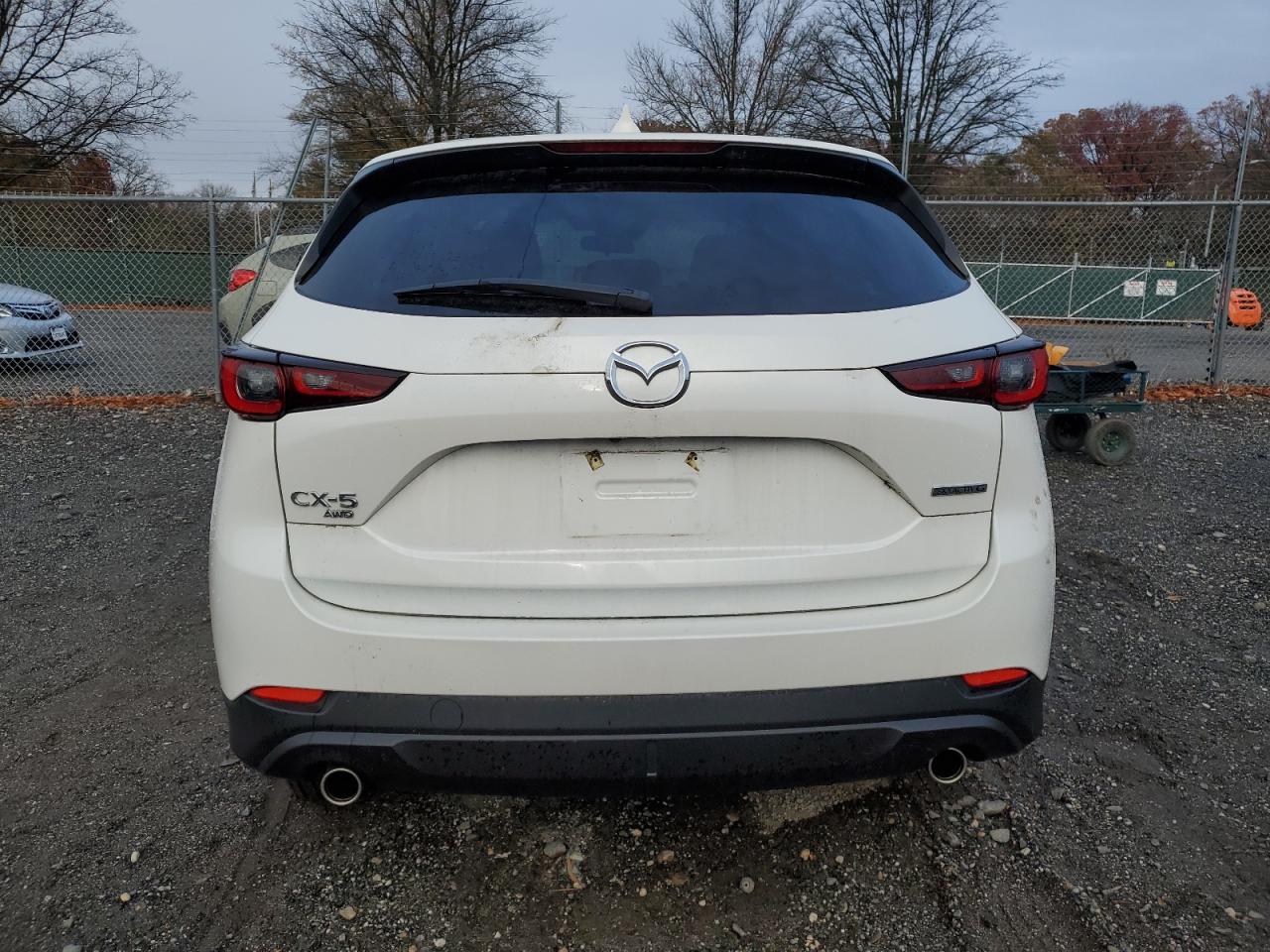 2022 Mazda CX-5 VIN JM3KFBBMXN0640587 Copart auction photo, undercarriage / front end damage thumbnail 6