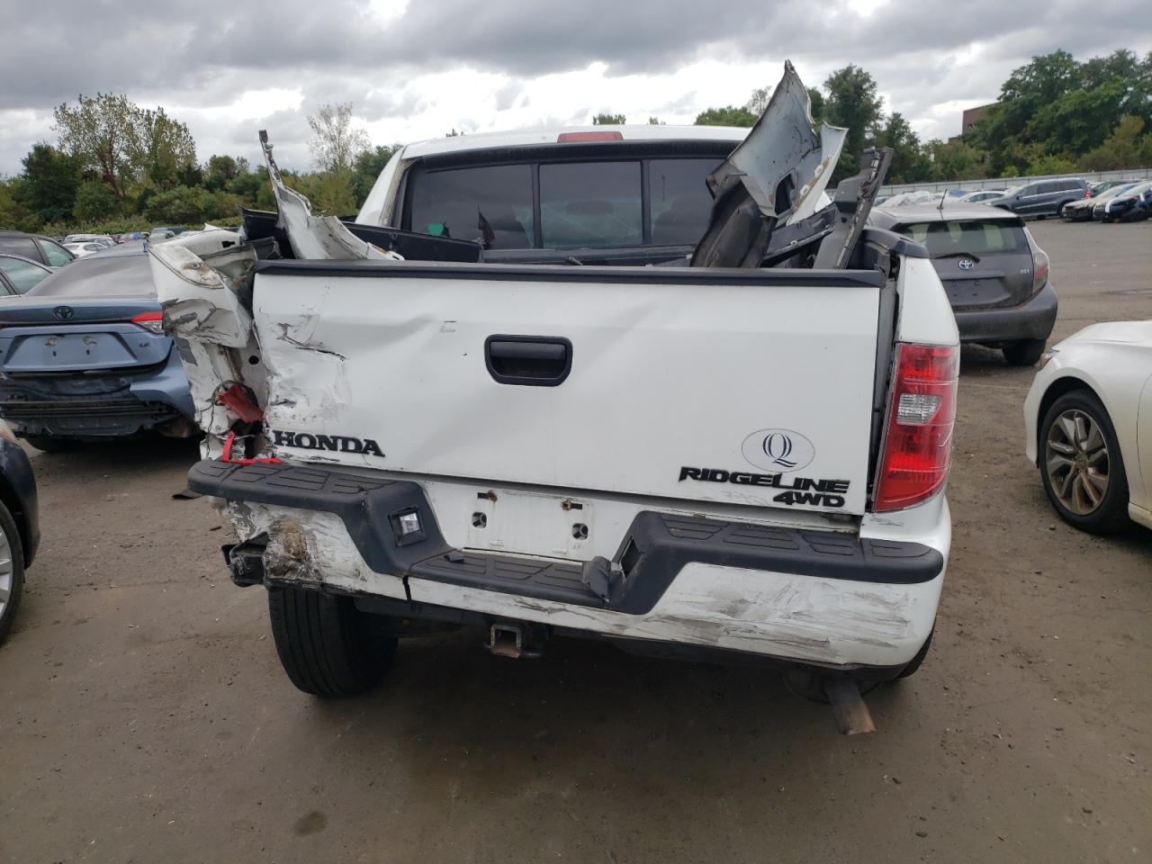 2010 Honda Ridgeline VIN 5FPYK1F2XAB013103 Copart auction photo, all over damage thumbnail 6