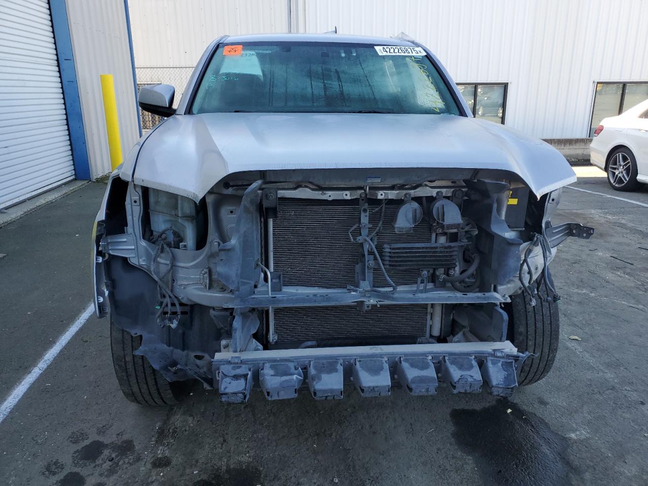 2017 Toyota Tacoma VIN 3TMAZ5CNXHM046510 Copart auction photo, front end / all over damage thumbnail 5