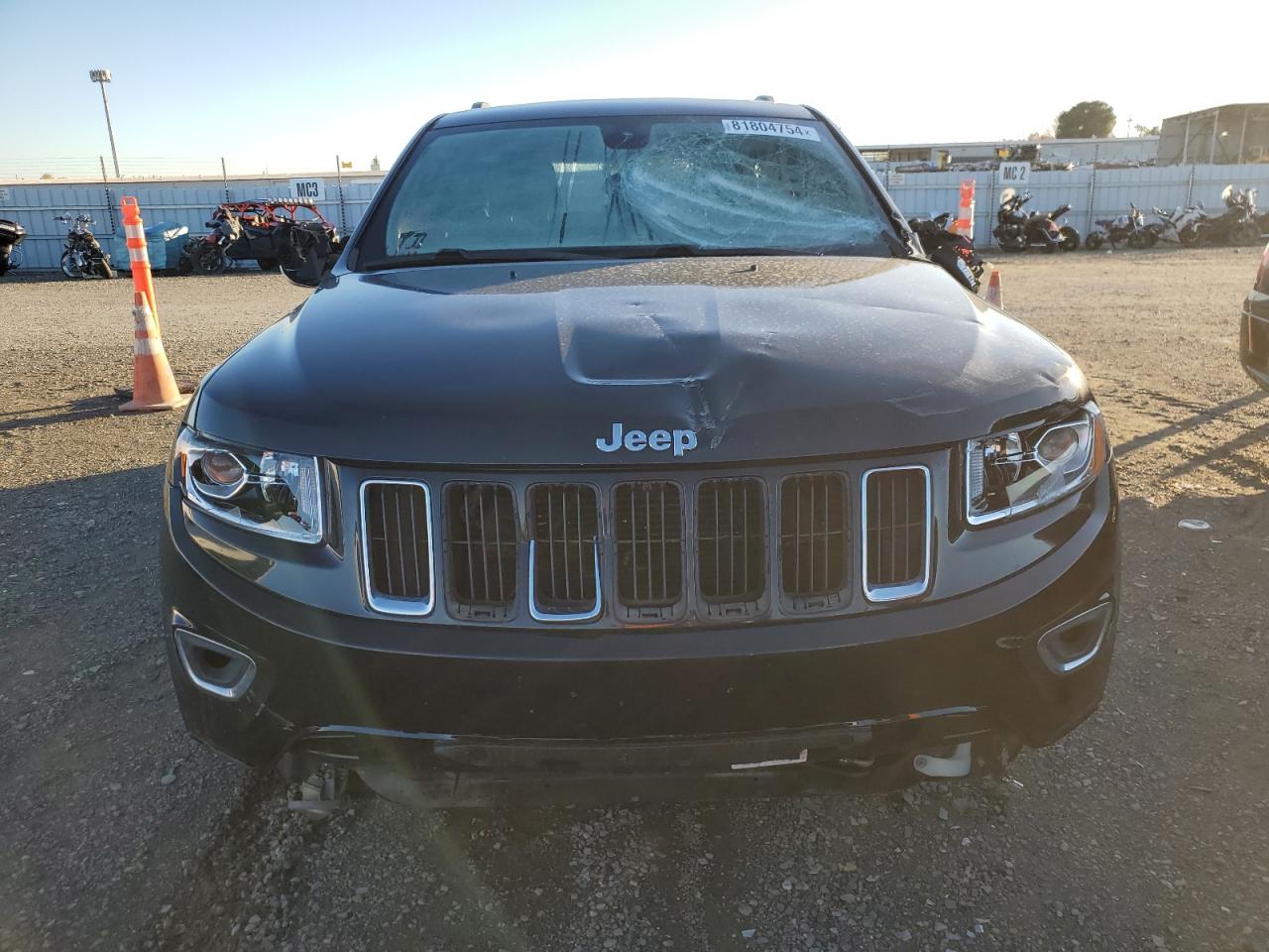 2015 Jeep Grand Cherokee VIN 1C4RJFBG9FC839525 Copart auction photo, vandalism damage thumbnail 5