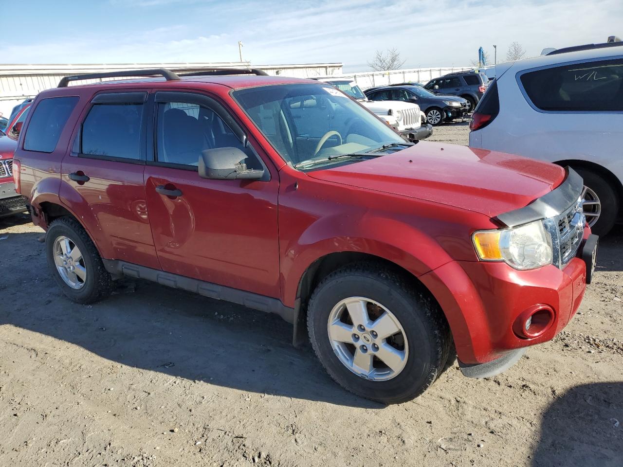2011 Ford Escape VIN 1FMCU0C73BKB11803 Copart auction photo, rear end / side damage thumbnail 4