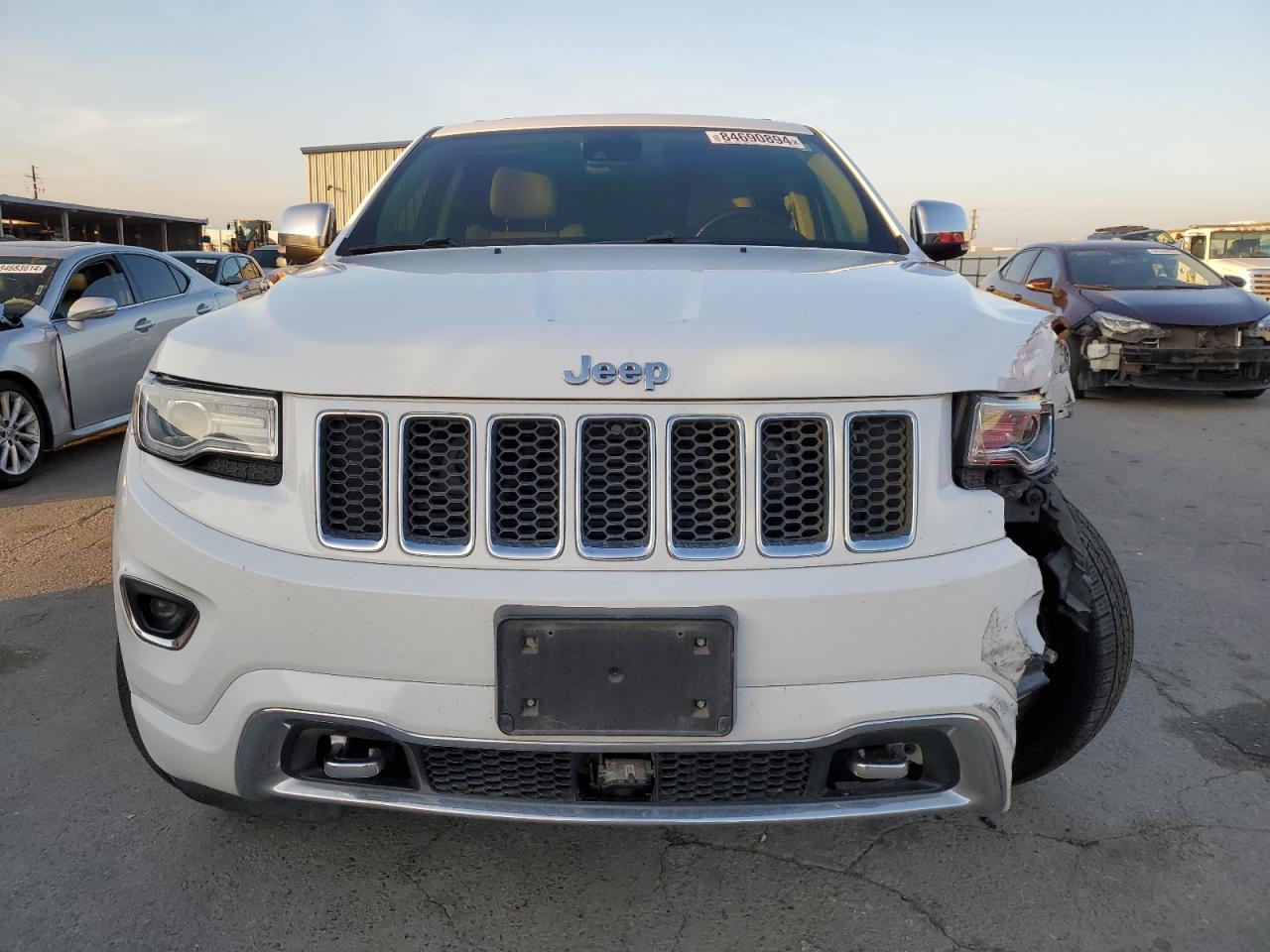 2014 Jeep Grand Cherokee VIN 1C4RJFCM0EC299937 Copart auction photo, front end / undercarriage damage thumbnail 5