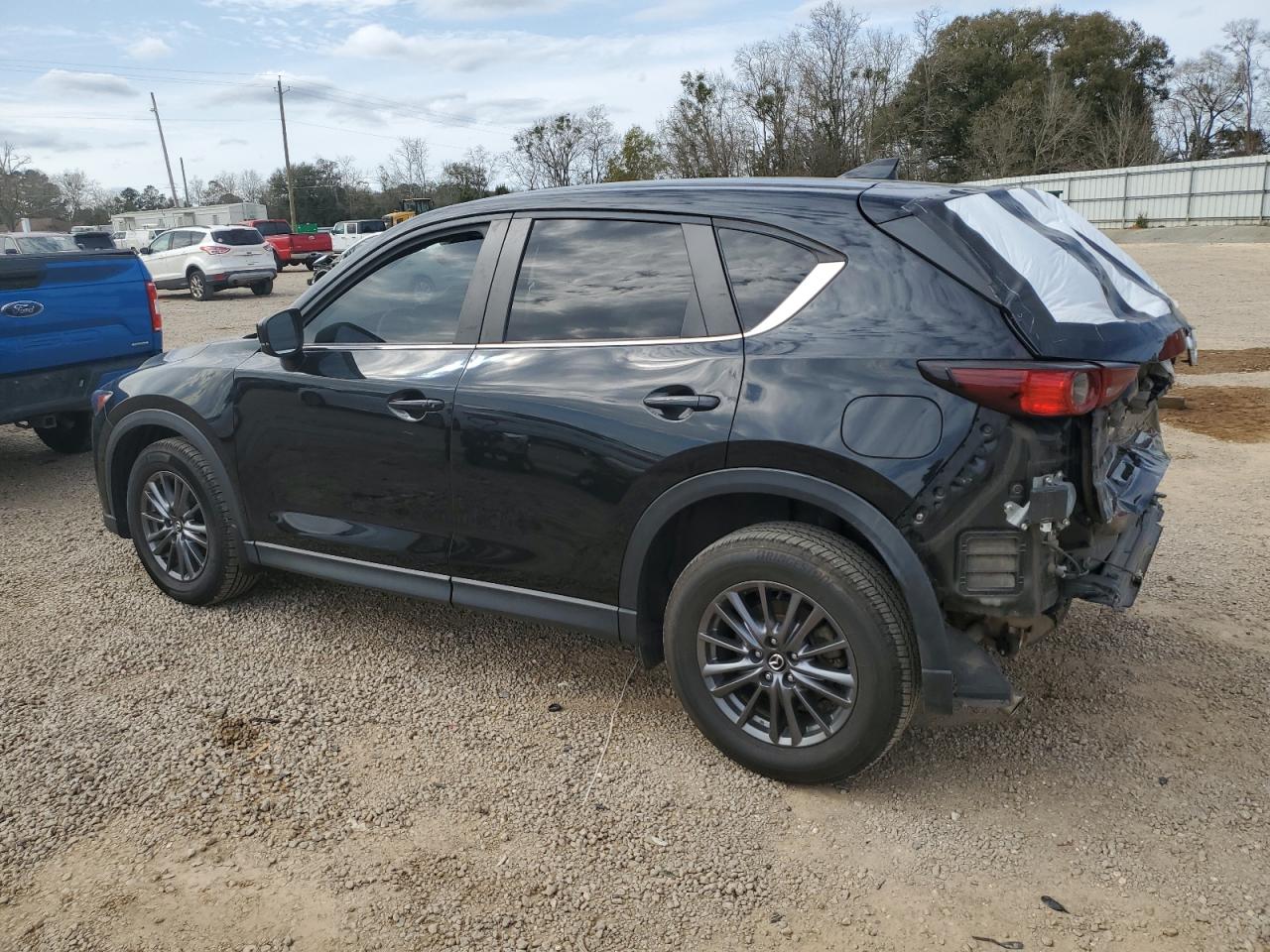 2021 Mazda CX-5 VIN JM3KFACM9M0319597 Copart auction photo, rear end / minor dent/scratches damage thumbnail 2