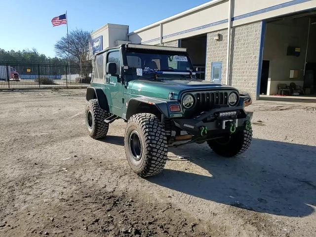 2000 Jeep Wrangler VIN 1J4FA49S3YP760214 Copart auction photo, front end / minor dent/scratches damage thumbnail 12