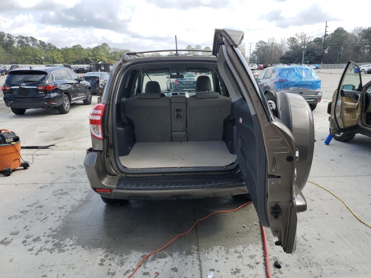 2010 Toyota RAV 4 VIN JTMZF4DV2AD019663 Copart auction photo, side damage thumbnail 6