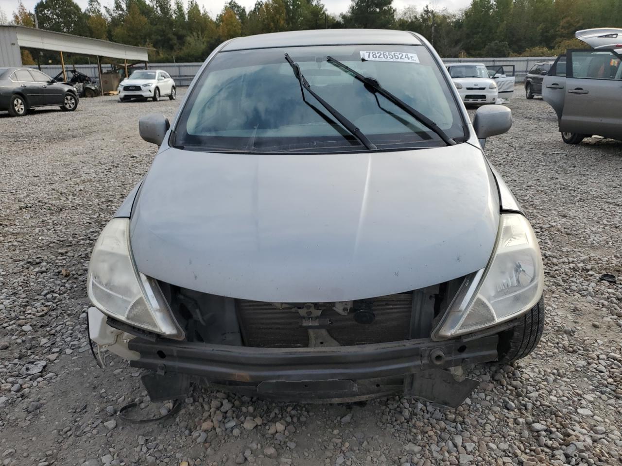 2010 Nissan Versa VIN 3N1BC1CP1AL411123 Copart auction photo, front end / side damage thumbnail 5
