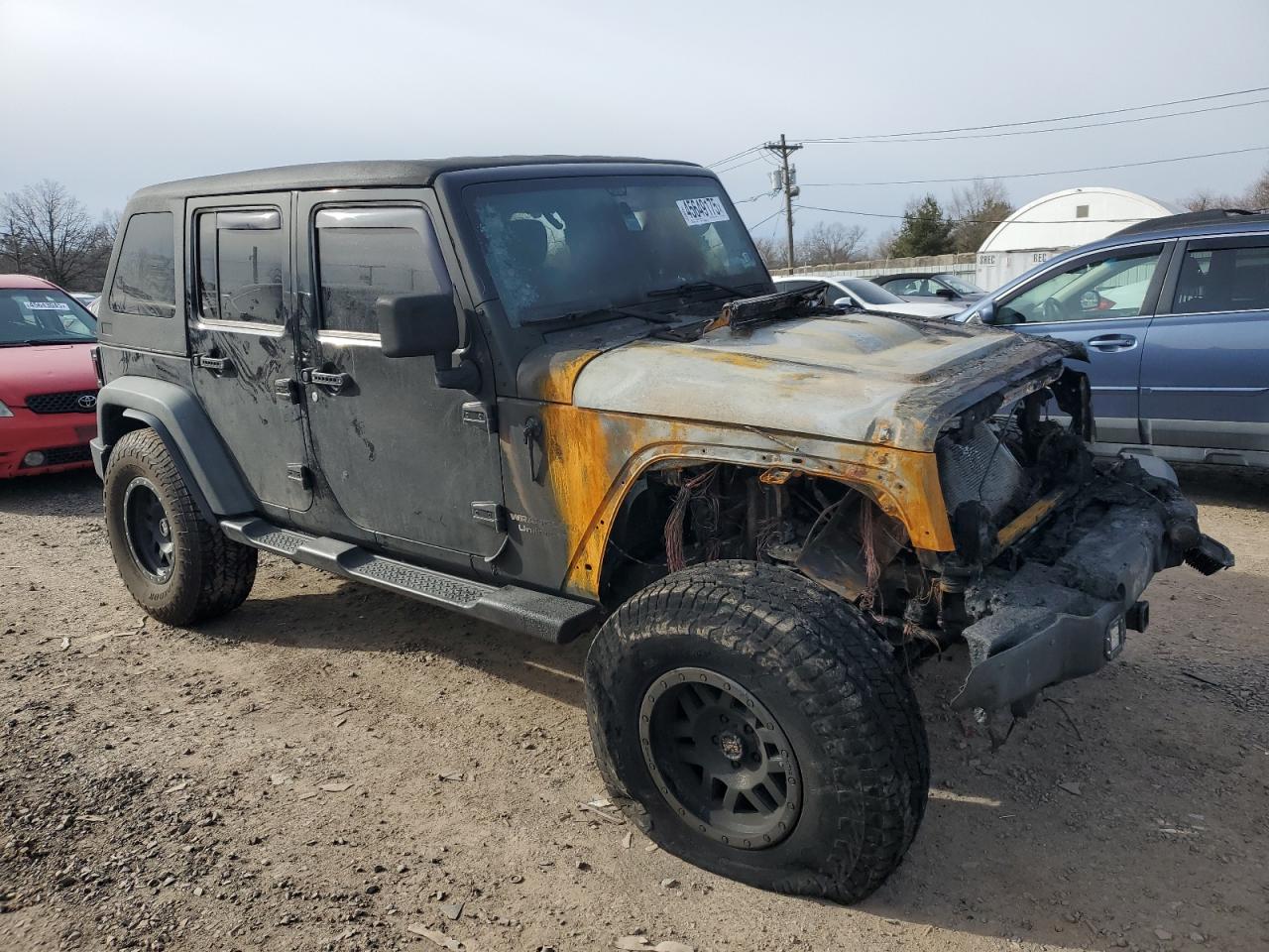 2011 Jeep Wrangler VIN 1J4BA3H19BL600502 Copart auction photo, burn damage thumbnail 4