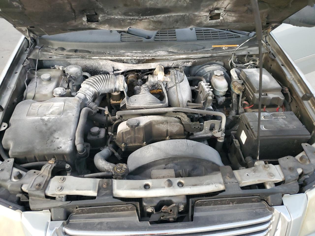 2008 GMC Envoy VIN 1GKDS13S282122684 Copart auction photo, burn - engine damage thumbnail 11