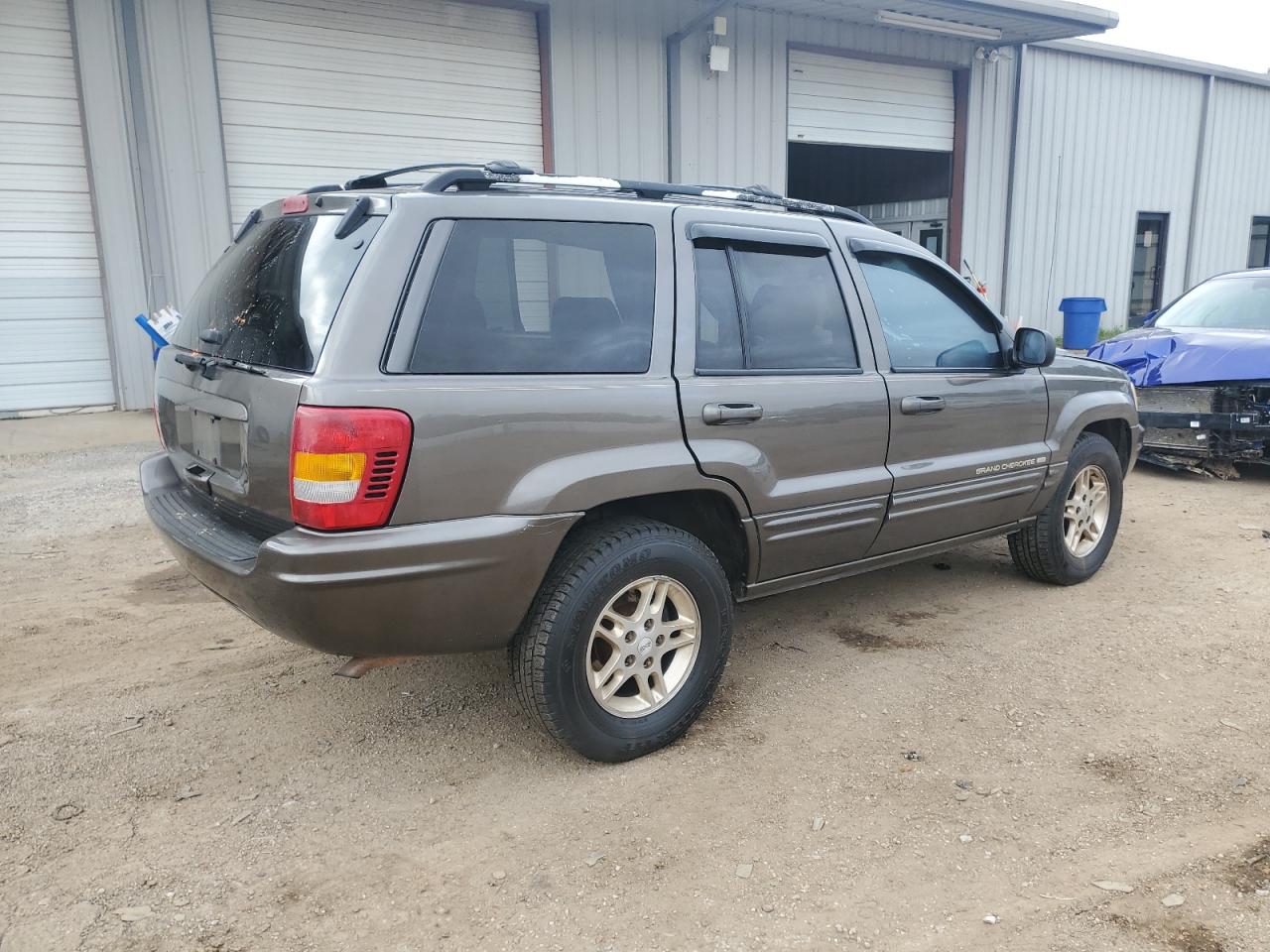 1999 Jeep Grand Cherokee VIN 1J4G268S3XC728805 Copart auction photo, side damage thumbnail 3