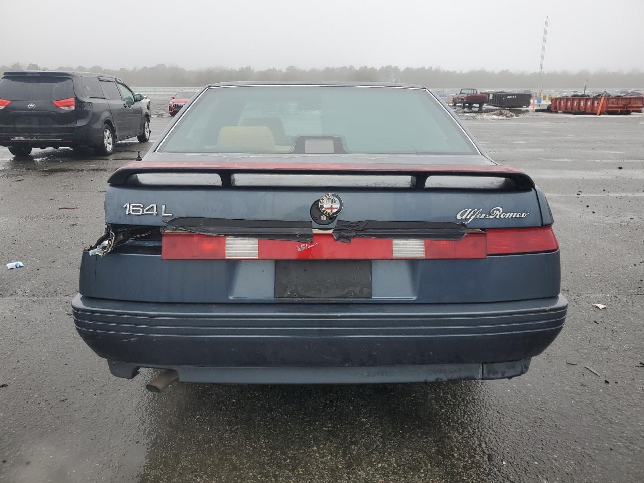 1991 Alfa Romeo 164 VIN ZAREA43L5M6171139 Copart auction photo, rear end / minor dent/scratches damage thumbnail 6