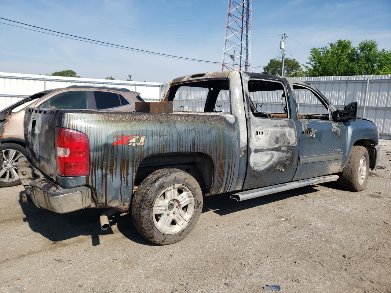 2013 Chevrolet Silverado VIN 3GCPKSE75DG169510 Copart auction photo, burn damage thumbnail 3