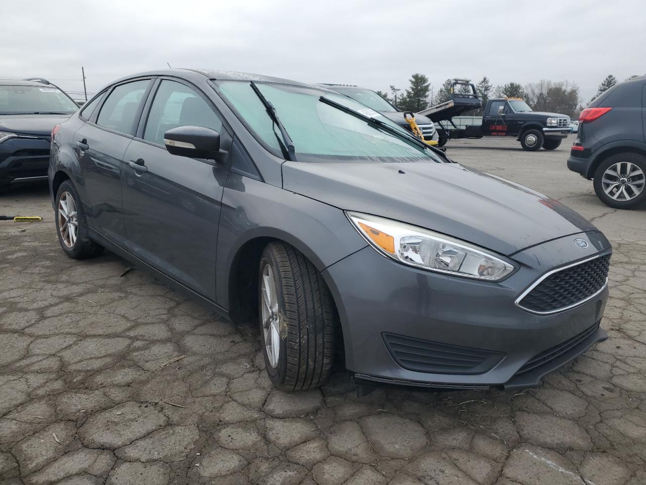 2015 Ford Focus VIN 1FADP3F22FL353540 Copart auction photo, side / front end damage thumbnail 4