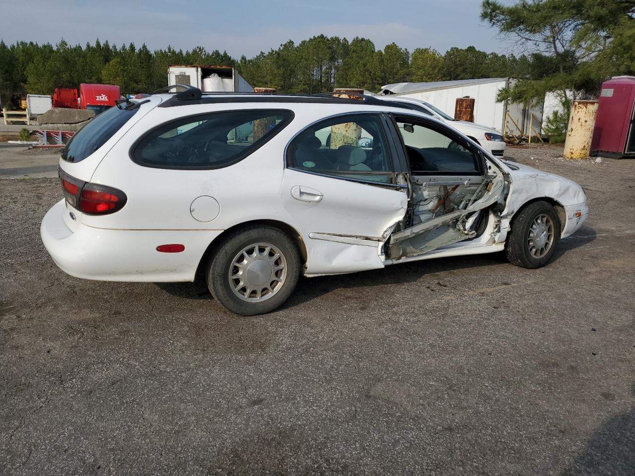 1999 Ford Taurus VIN 1FAFP58S0XA272714 Copart auction photo, side / front end damage thumbnail 3