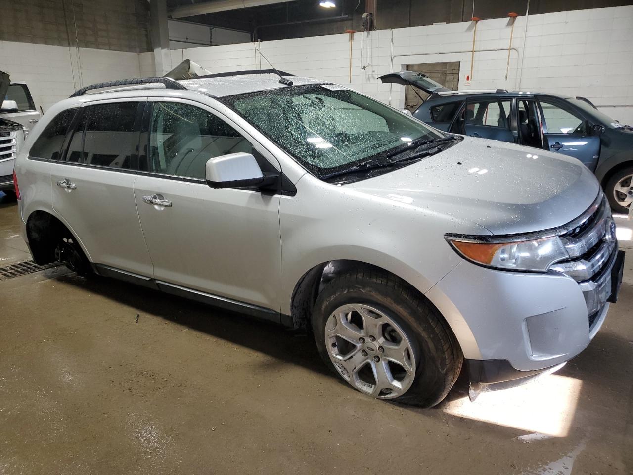 2011 Ford Edge VIN 2FMDK3JC3BBA47624 Copart auction photo, rear end / front end damage thumbnail 4