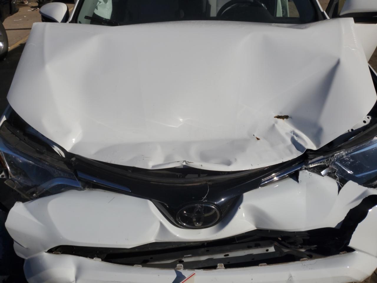 2018 Toyota RAV 4 VIN JTMRFREV2JJ210867 Copart auction photo, front end / minor dent/scratches damage thumbnail 12