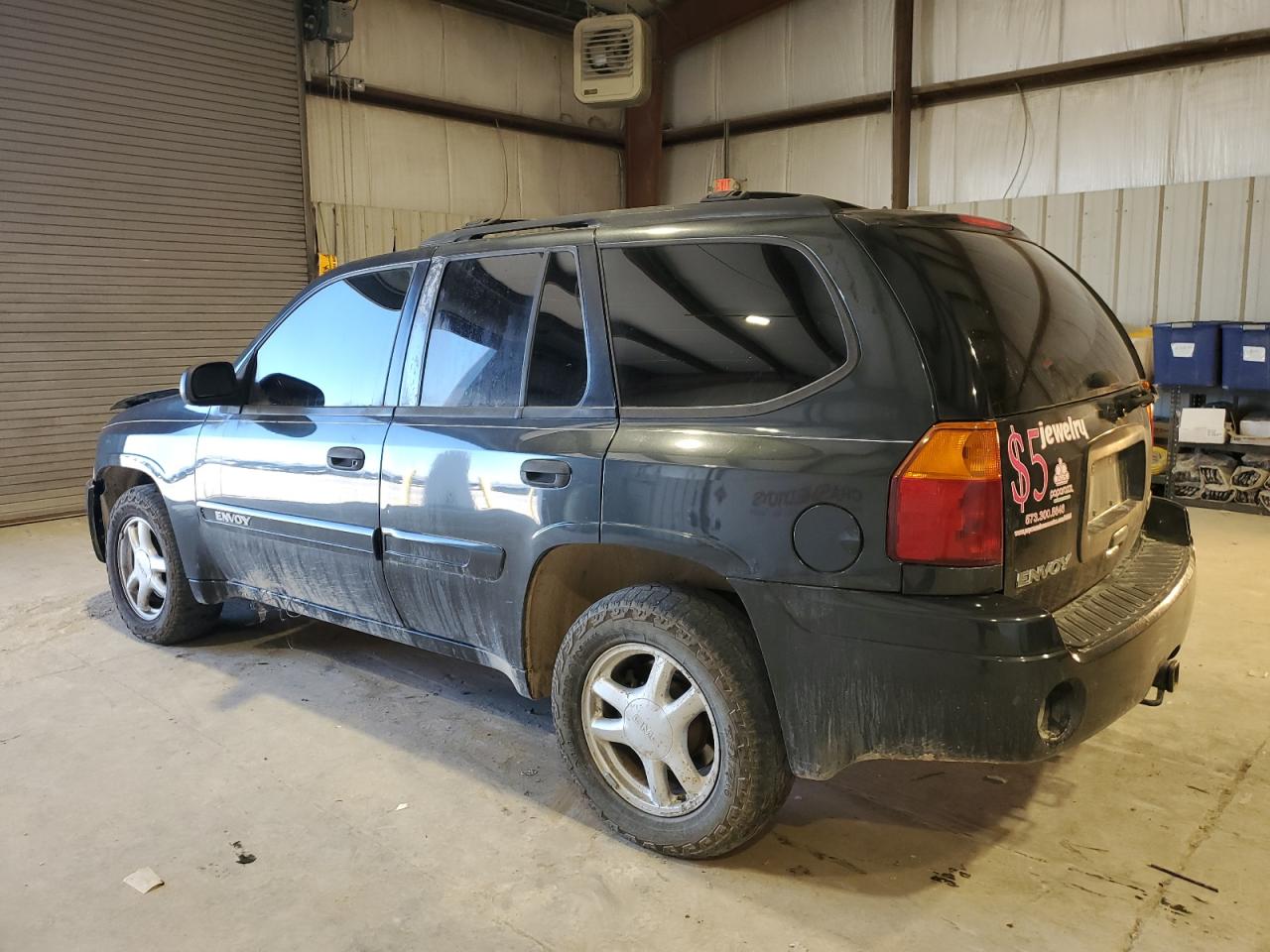 2005 GMC Envoy VIN 1GKDT13S752168679 Copart auction photo, burn - interior damage thumbnail 2