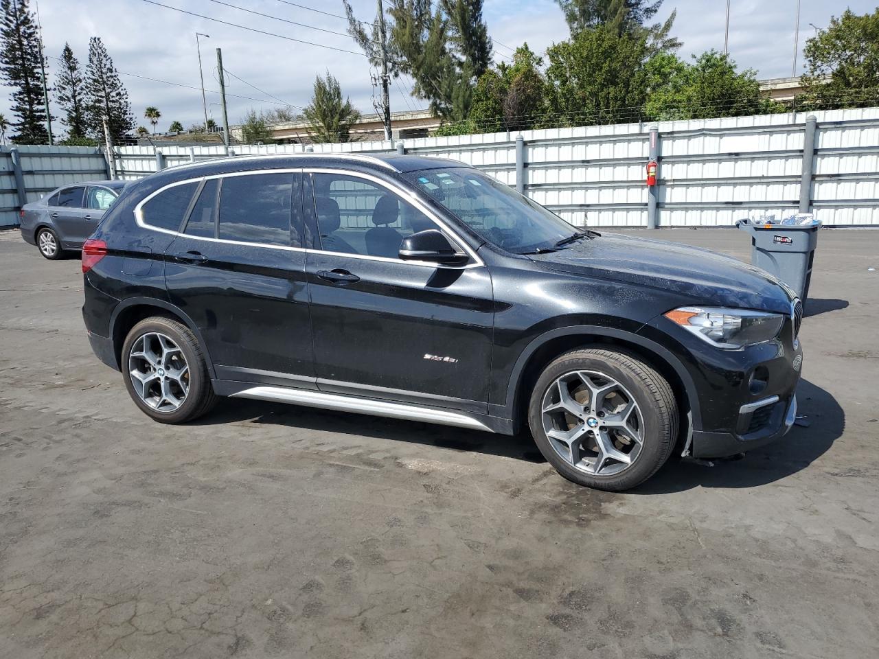 2018 BMW X1 VIN WBXHU7C31J5H42892 Copart auction photo, water/flood damage thumbnail 4