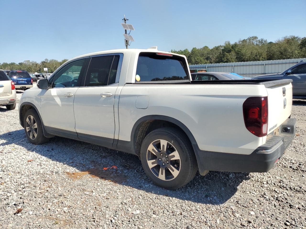 2017 Honda Ridgeline VIN 5FPYK2F65HB006532 Copart auction photo, side / front end damage thumbnail 2