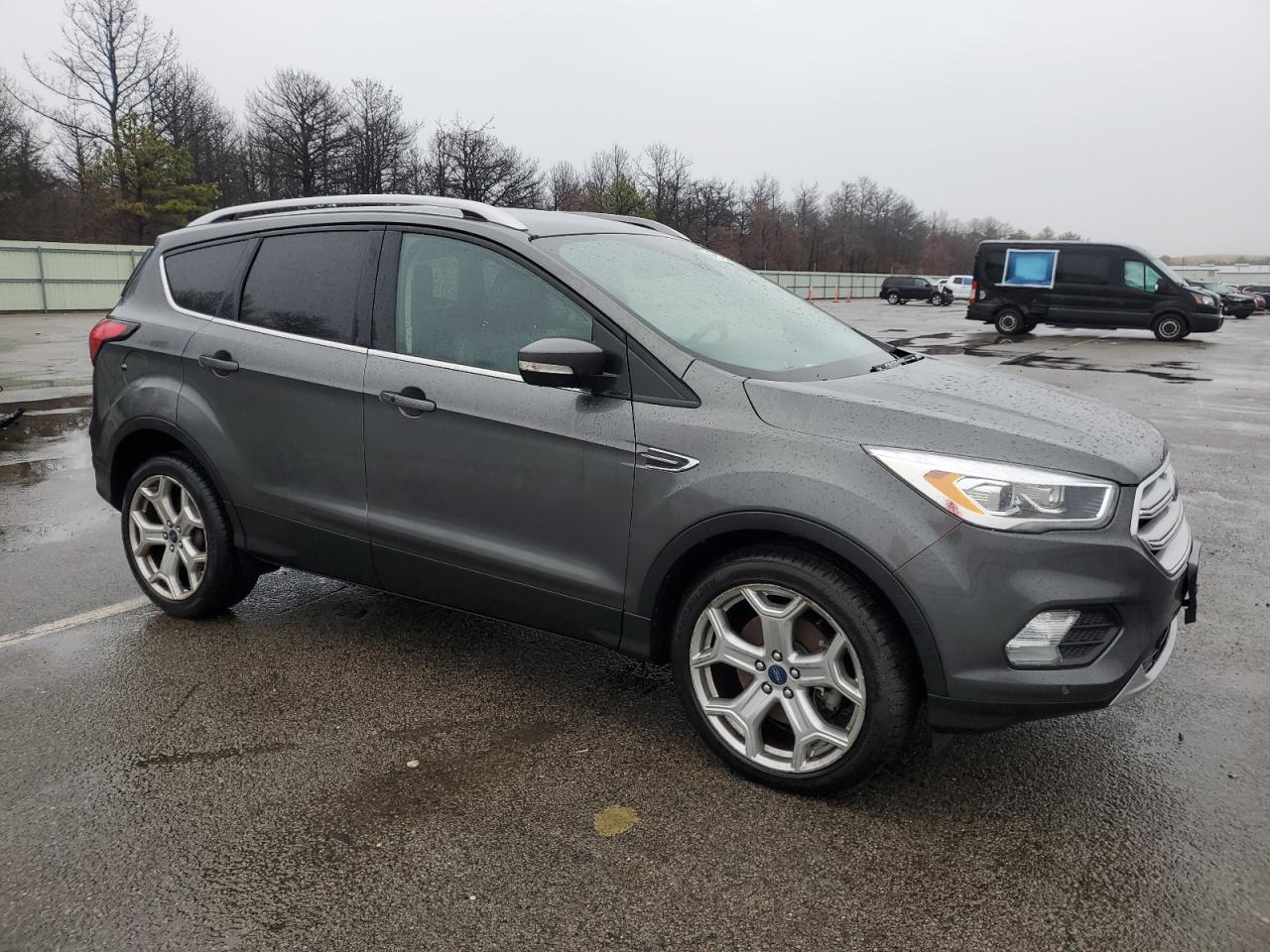 2019 Ford Escape VIN 1FMCU9J95KUA84794 Copart auction photo, vandalism / minor dent/scratches damage thumbnail 4
