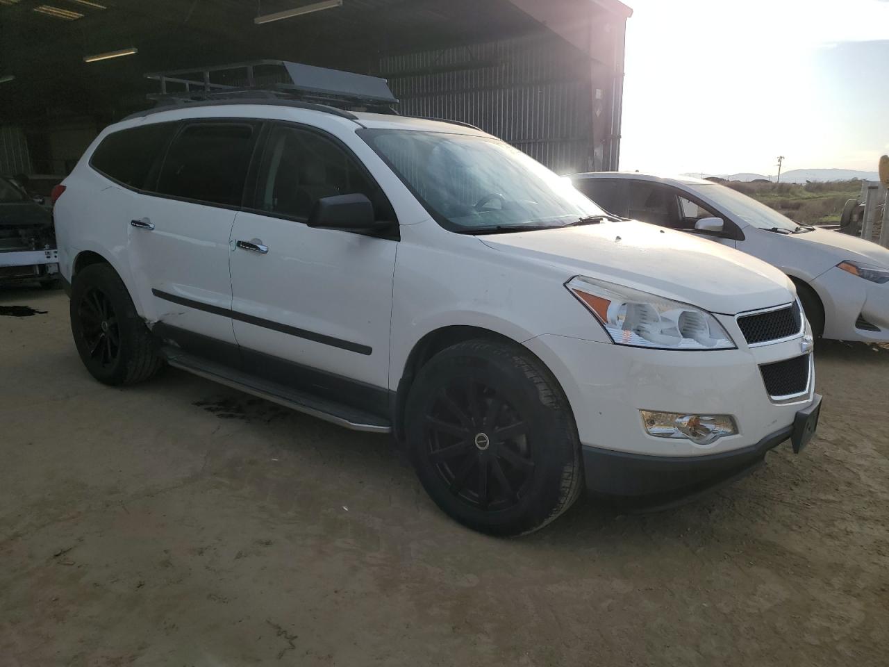 2012 Chevrolet Traverse VIN 1GNKRFED8CJ387450 Copart auction photo, side / rear end damage thumbnail 4