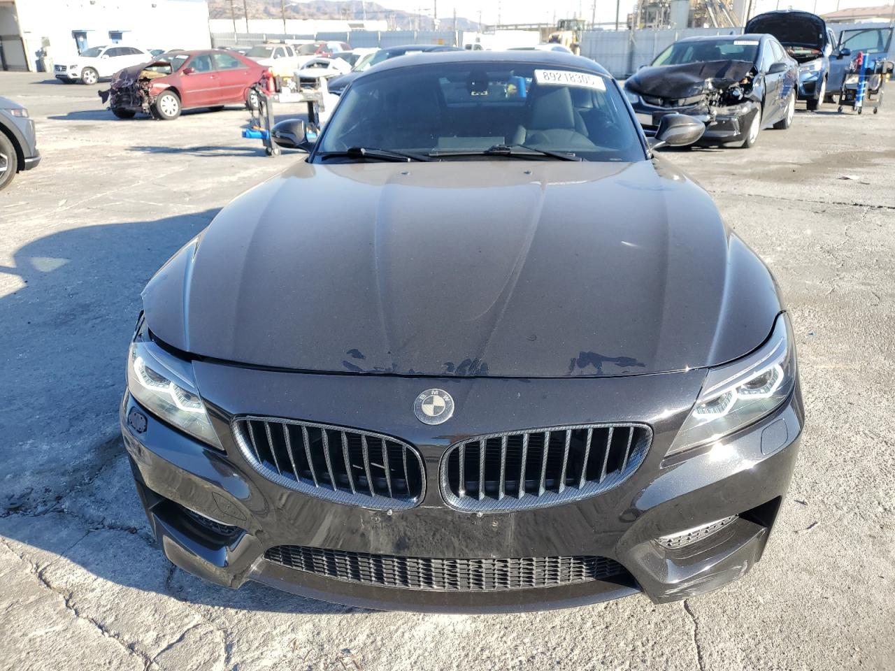 2011 BMW Z4 VIN WBALM1C58BE393909 Copart auction photo, rear end / side damage thumbnail 5